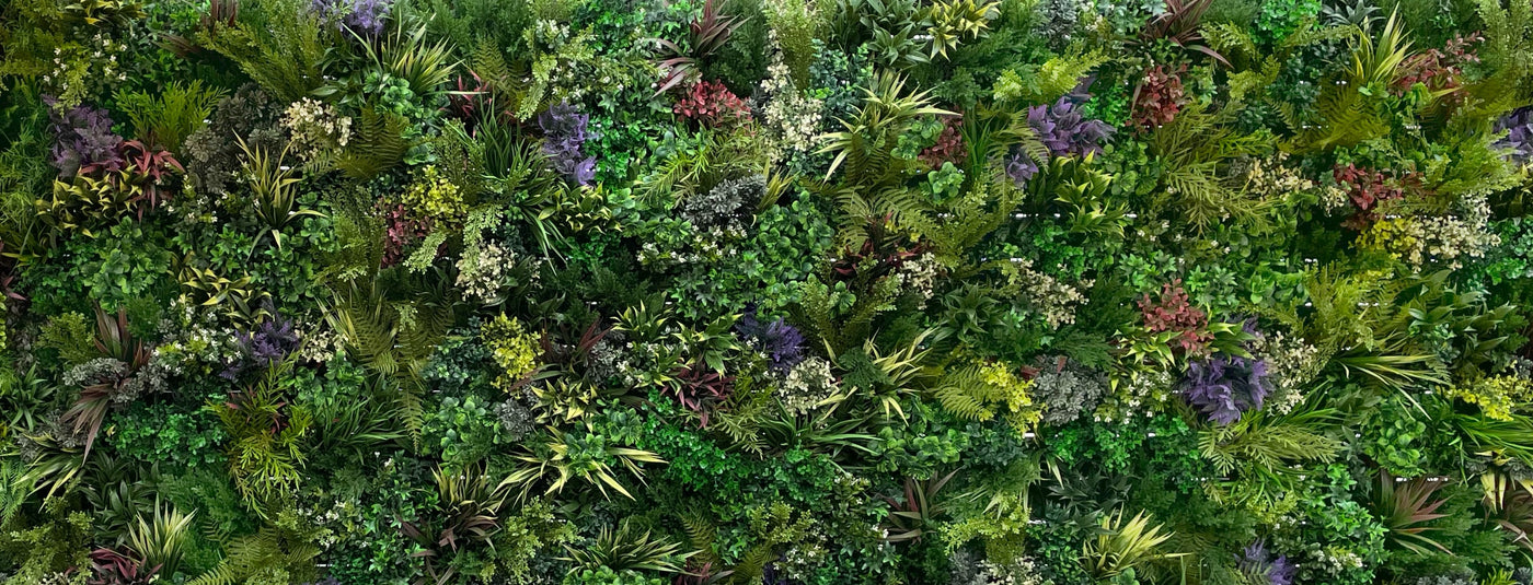 Artificial green wall panel with variegated mixed green, yellow, red foliage & white flowers 100x100 cm