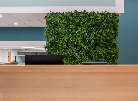 Artificial green wall panel with mixed green orange red and white foliage, white and yellow flowers 100x100 cm